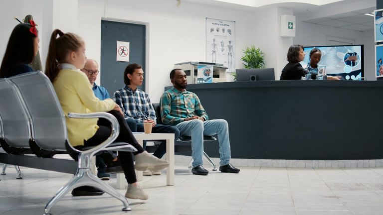 diverse group people waiting hospital reception