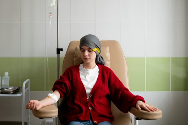 patient sitting on the chair getting chemotherapy treatment